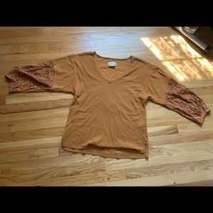Anthropologie rust top with floral sleeve